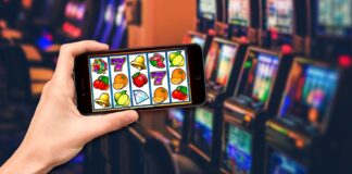 How Online Casino Slot Machines Are Built A picture containing text, person, slot machine Description automatically generated