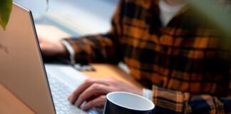 Finding the Best Provider for Your GIS File Conversions person in brown and black plaid dress shirt using macbook air