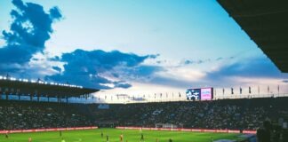 How to Put Together a Competitive FPL Team on a Budget During Mid Season people watching soccer arena