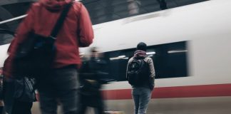 Ways to Make Your Daily Commute More Enjoyable people standing beside train