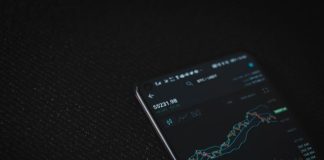 Tremendous Benefits of Trading in Cryptocurrency black android smartphone on black textile