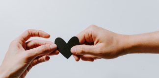 How to Save Your Relationship: Simple Tips to Help You Succeed two person holding papercut heart