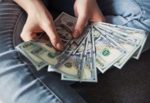 6 Ways Personal Loans Help You Save Money In The Long Run fan of 100 U.S. dollar banknotes