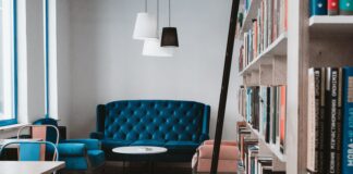Five Basic Misconceptions Of Interior Designing To Shed Off  tufted blue 3-seat sofa near white wall and window