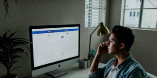 Do Top Beginners Affiliate Programs Actually Serve As Affiliate Saviors? man in blue denim jacket facing turned on monitor