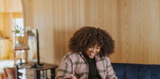 Discover the Advantages of Pay N Play Casino Sites person sitting on couch holding a Surface device