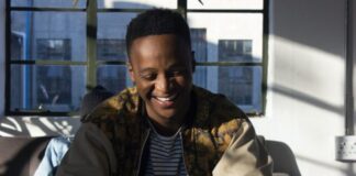 5 Apps to Pass the Time Productively man holding phone