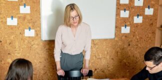 5 Strategies for Scaling Your Small Business Free A Businesswoman Talking to Her Employees Stock Photo