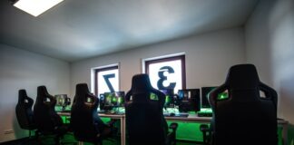 Unleash Your Inner Pro Gamer: The Ultimate List of Gaming Accessories You Need black office rolling chair near black flat screen computer monitor