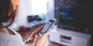 The Latest Trends and Innovations in Smart Home Technology and How To Use Them Woman Wearing White V Neck Shirt Using Space Gray Iphone 6