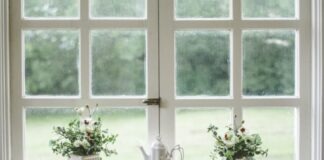 Adding Style And Comfort To Your Home With New Windows white teapot and tow flower vases on windowpane
