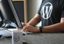 How to Switch to WordPress from Any Website or CMS person in black and white t-shirt using computer