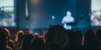 What Makes a Great Conference? Unveiling the Secrets to Memorable Events people watching concert during night time