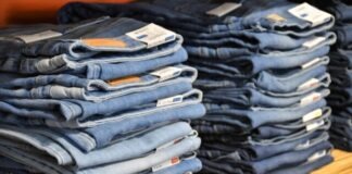 Denim Decoded – Finding Your Signature Style in the Skinny vs. Straight-Fit Debate pile of blue denim jeans lot