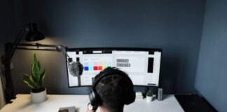 Remote Work and Pay Stubs: What Gamers Need to Know man in black shirt sitting in front of computer