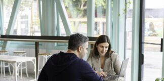 Take Your Sales to the Next Level With Guided Selling Software A sales representative offers custom solutions to a client based on guided selling techniques