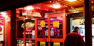 Can You Withdraw an Online Casino Bonus? man in red shirt standing near store