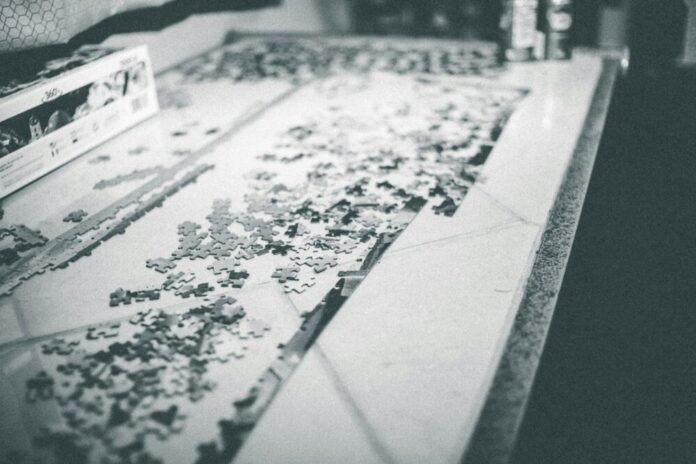 Photo by Erik Mclean a close up of a counter top with flowers on it