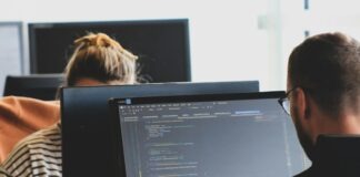 The Importance of Continuous Learning for an Associate Data Scientist woman in black shirt sitting beside black flat screen computer monitor