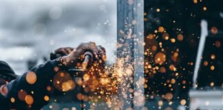 Embracing the Future: The Evolving Landscape of Industrial Automation person holding tool during daytime