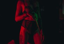 Discover Your Sexual Fantasies with Escorts woman in red lingerie singing